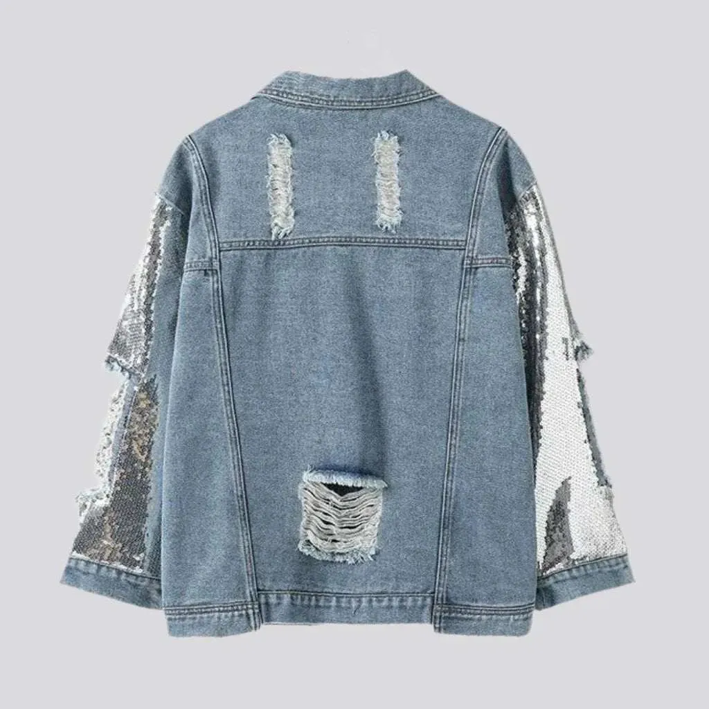 Fully distressed women's denim jacket